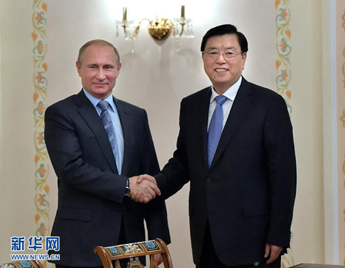 6月9日，全國人大常委會委員長張德江在莫斯科會見俄羅斯總統普京。新華社記者李濤攝